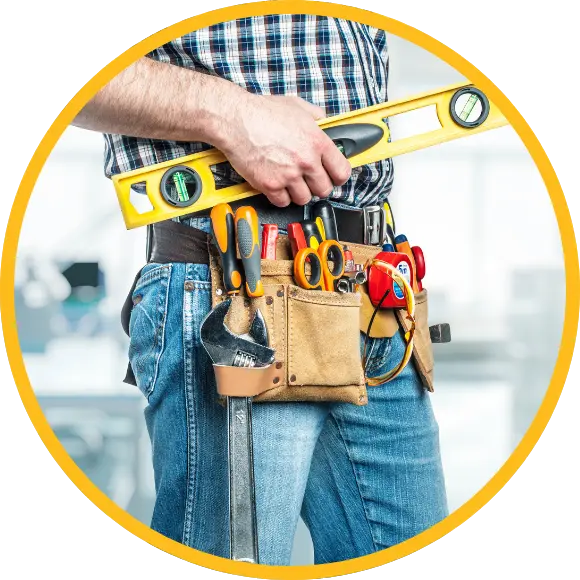 midsection of handyman highlighting toolbelt loaded with tools