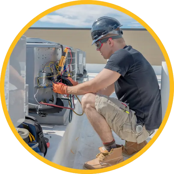 hvac worker fixing heat pump